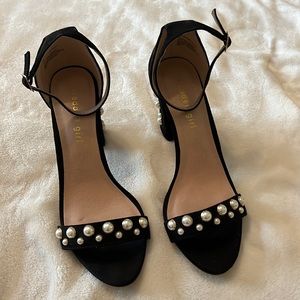 Black suede pumps